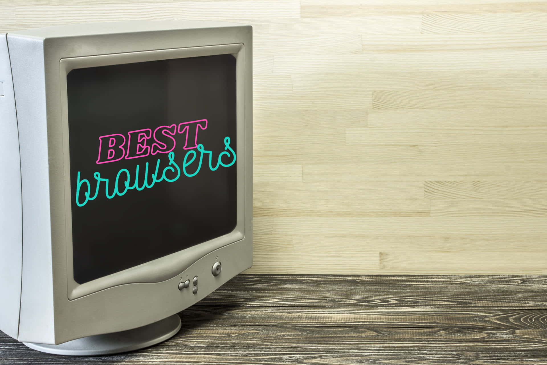 在木質表面上顯示霓虹文字「BEST browsers」的復古電腦顯示器。