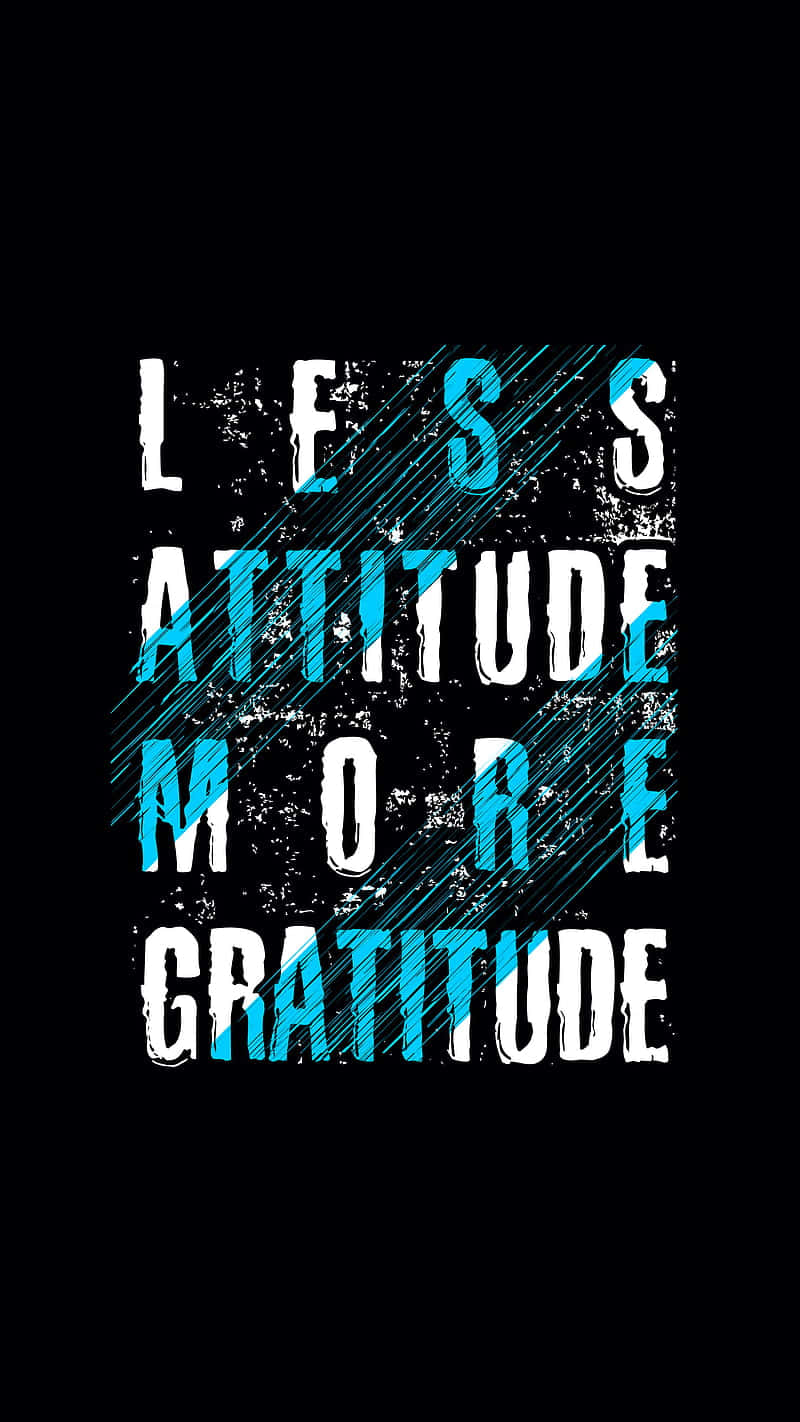 文字圖形，上面寫著 less attitude more gratitude，藍色和白色字體在黑色背景上。