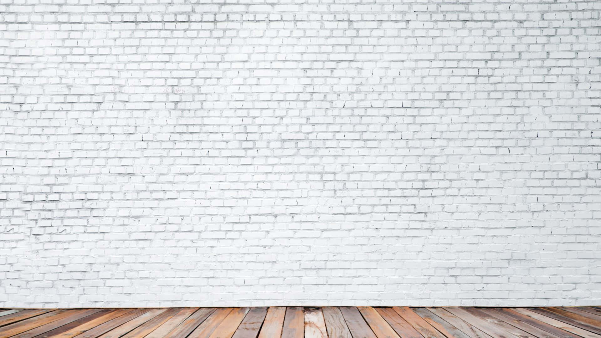 白色磚牆與木地板的空房間