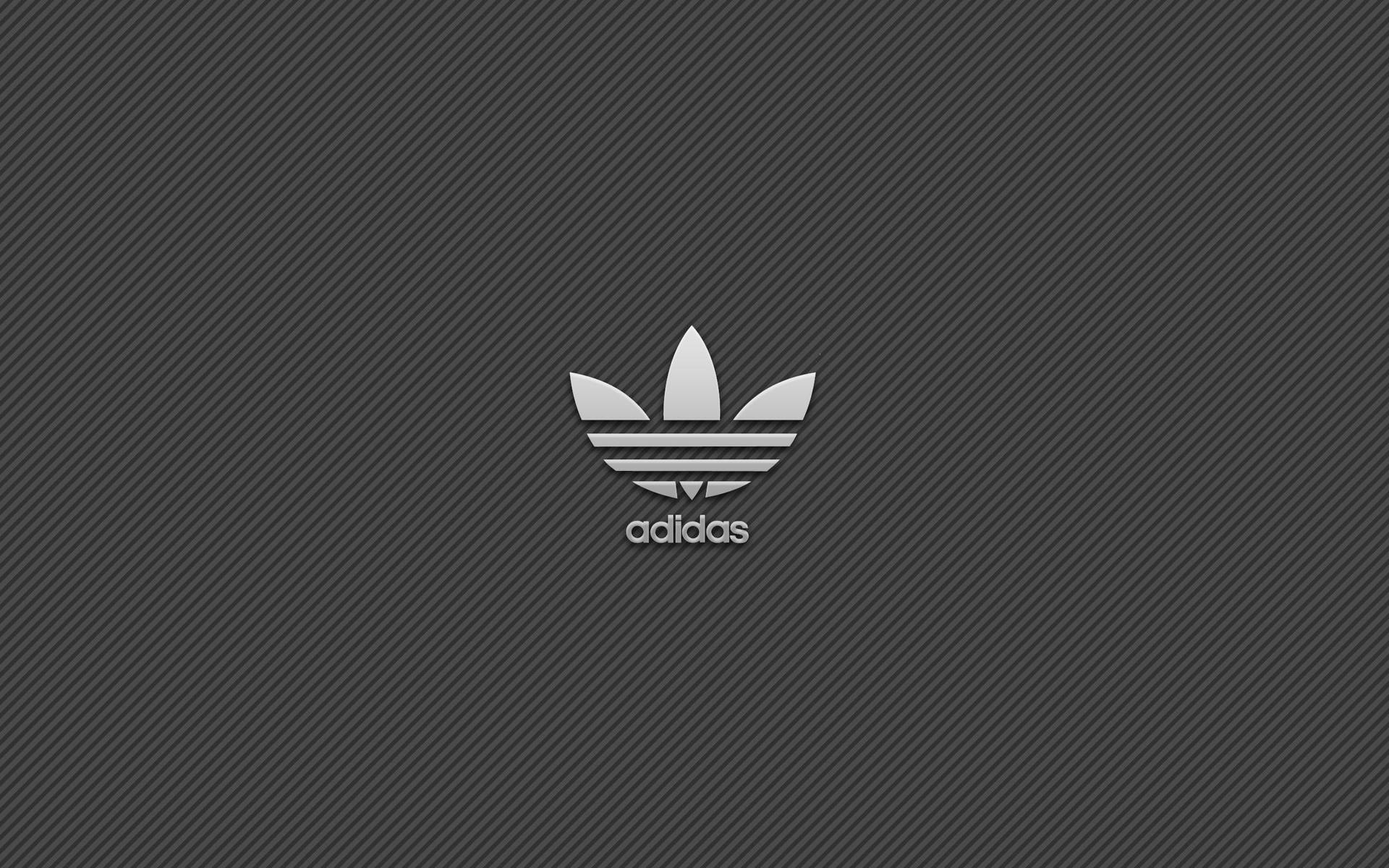 深灰色斜紋背景上的Adidas標誌