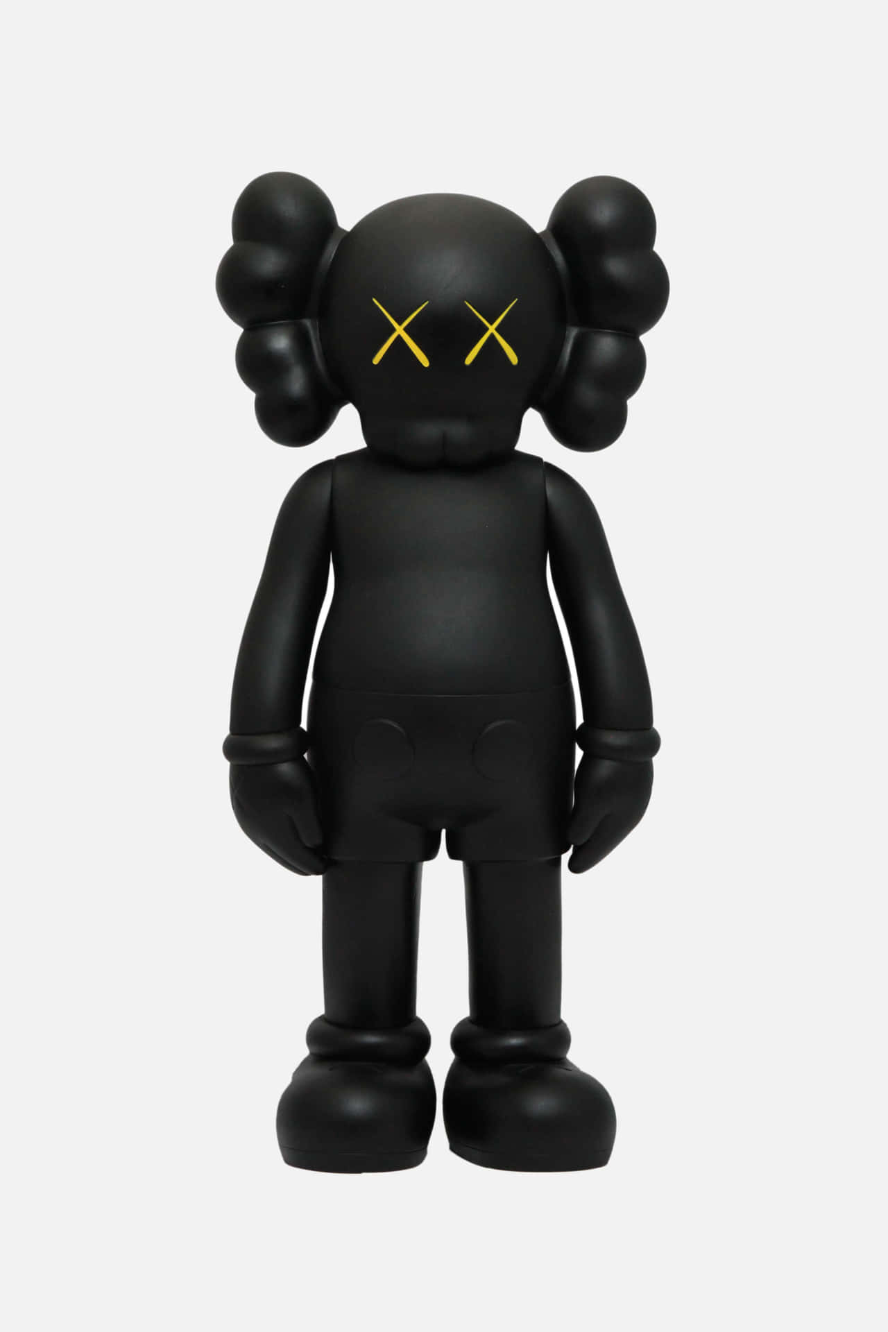 帶有黃色X眼睛的黑色KAWS Companion公仔靜止站立。