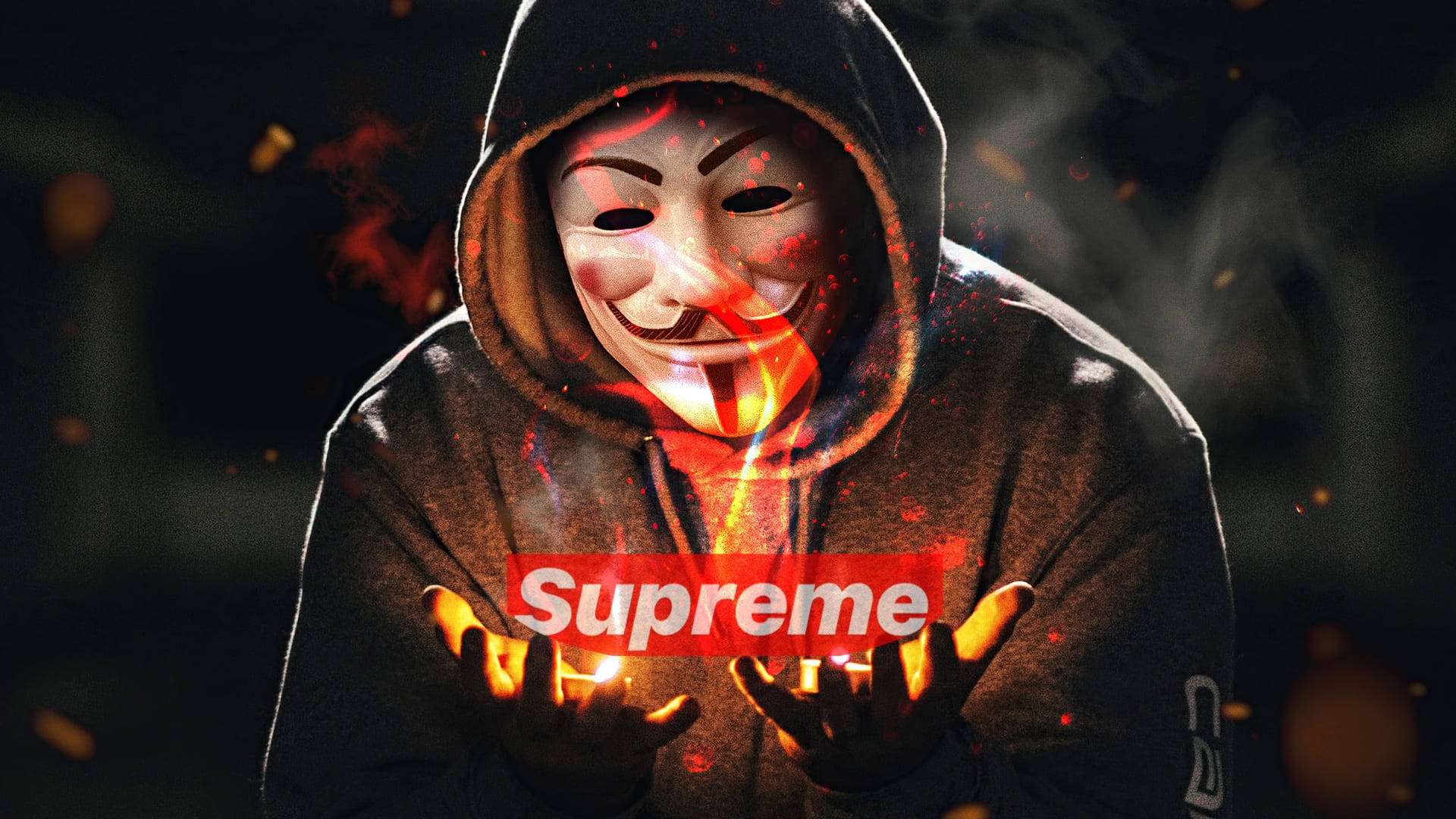酷炫Supreme發光雙手 壁紙 — 一個戴著蓋伊·福克斯面具的兜帽人物手持燃燒的Supreme標誌，火花在黑暗煙霧繚繞的環境中飛舞。