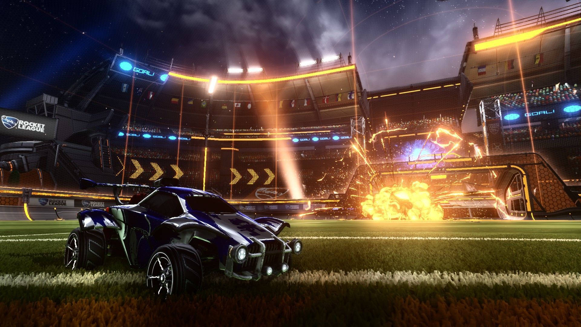 Rocket League 賽車在草地上奔馳，伴有爆炸和夜間體育場燈光
