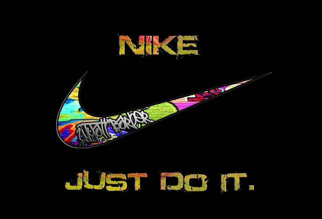 酷炫耐克塗鴉標誌 壁紙 — 一個充滿活力的塗鴉風格Nike剔號，帶有「JUST DO IT」文字，背景為黑色。