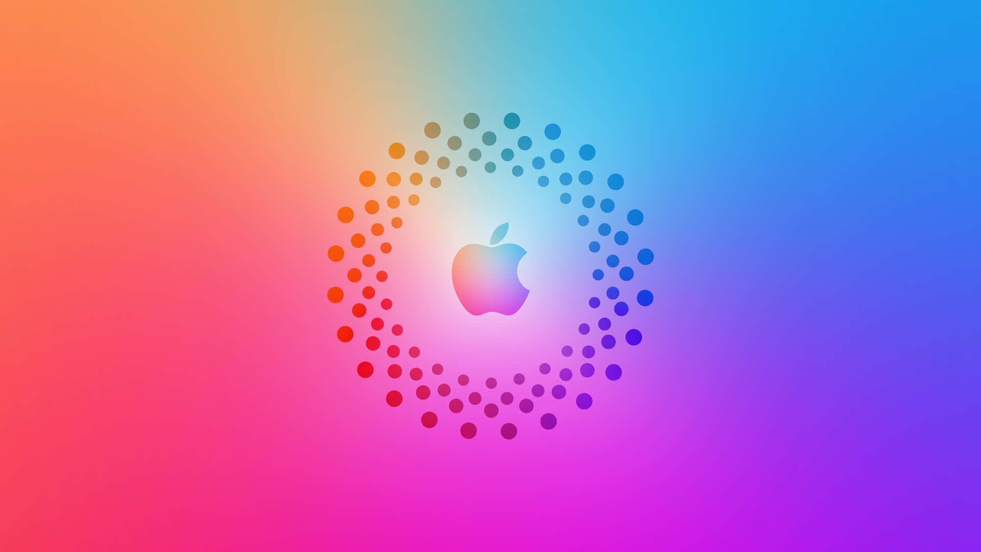 Apple 標誌被一圈點狀環繞，背景為色彩繽紛的漸變色。