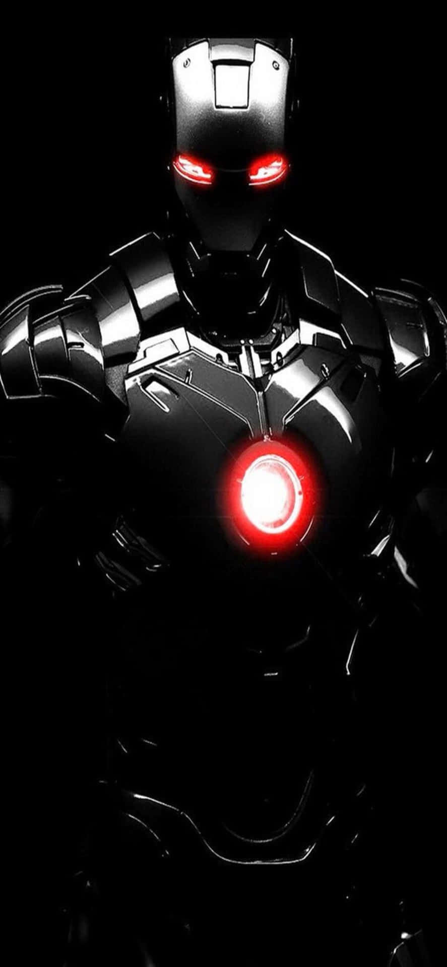 鐵甲奇俠在黑暗盔甲中發光的紅色弧形反應堆和眼睛。