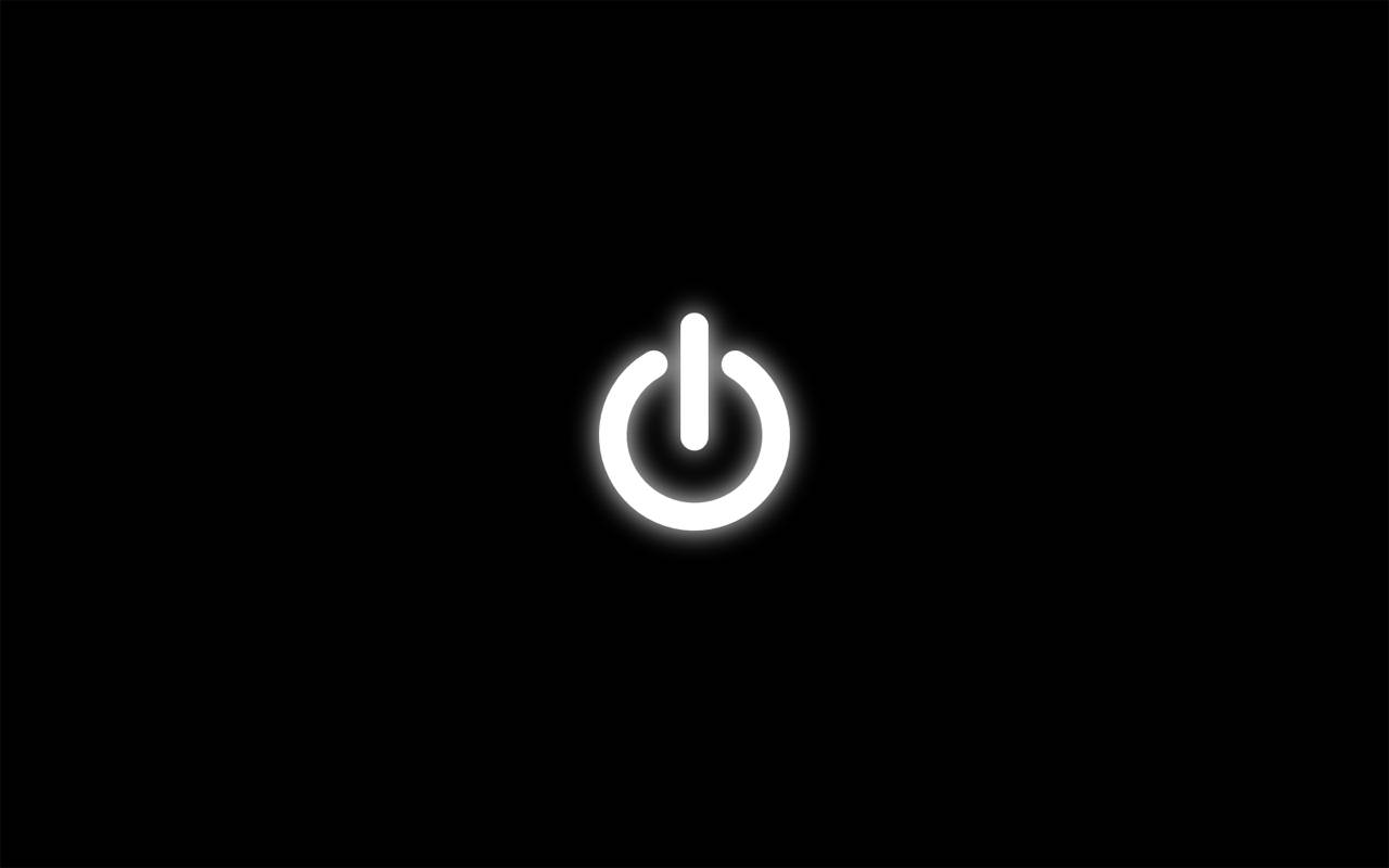 一個發光的白色電源按鈕圖標在黑色背景上。