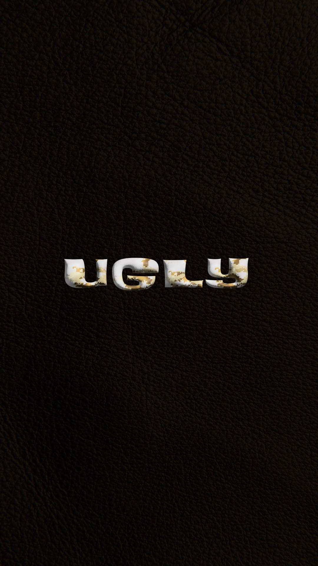 深色皮革背景上碎裂嘅白色字母寫住「ugly」。