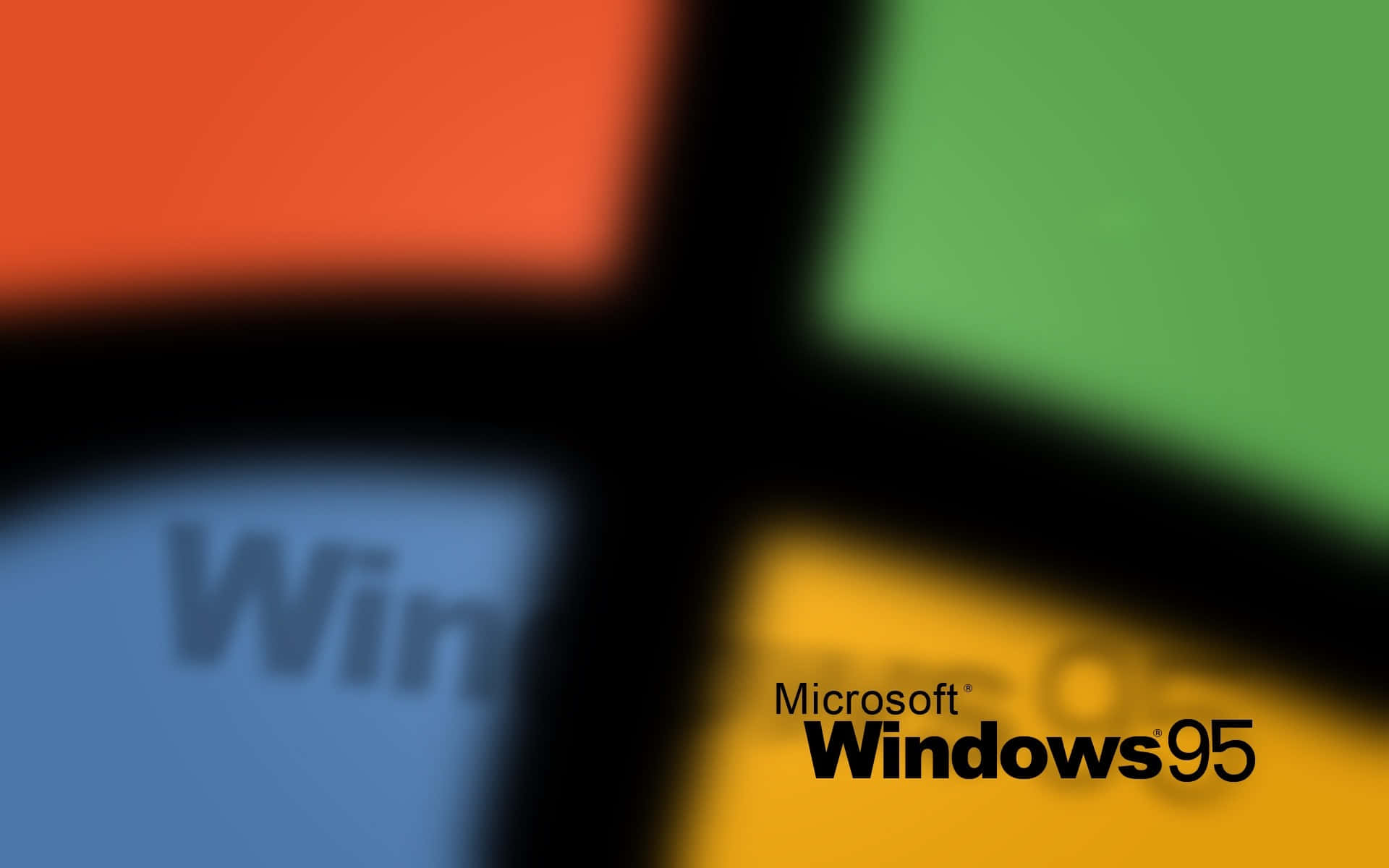 重溫 Windows 95 的懷舊體驗 壁紙 — Windows 95 標誌的模糊特寫，帶有四個彩色方塊和部分文字。
