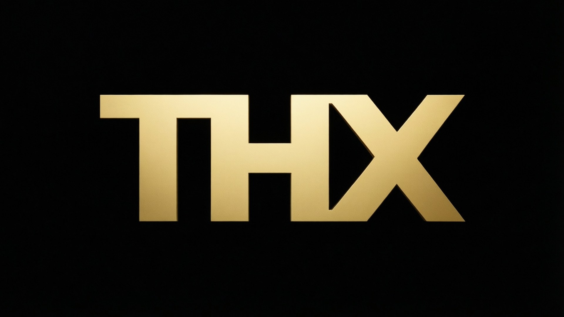 金屬THX極簡風 壁紙 — 大膽的金色THX標誌居中於純黑色背景上，帶有金屬光澤。