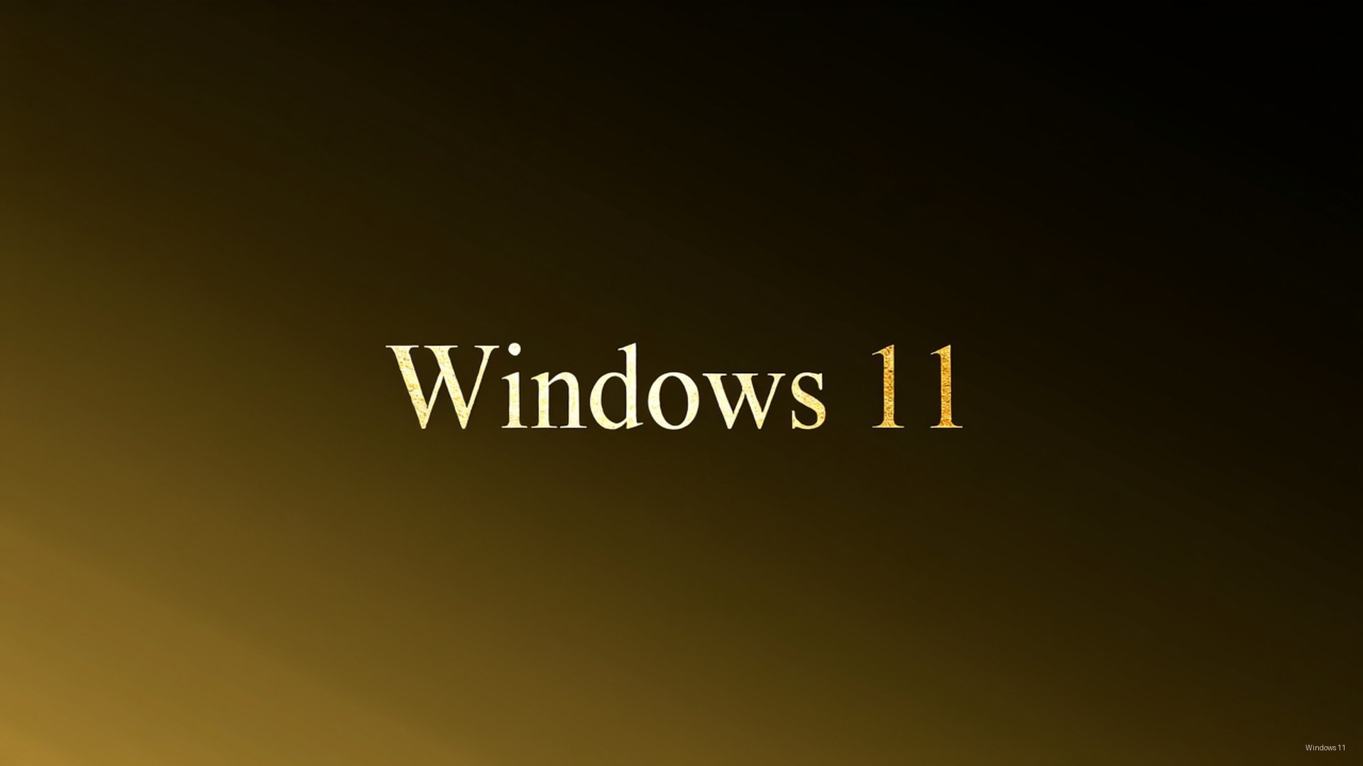 Windows 11 標誌以金色文字顯示於由深色漸變至金色的背景上