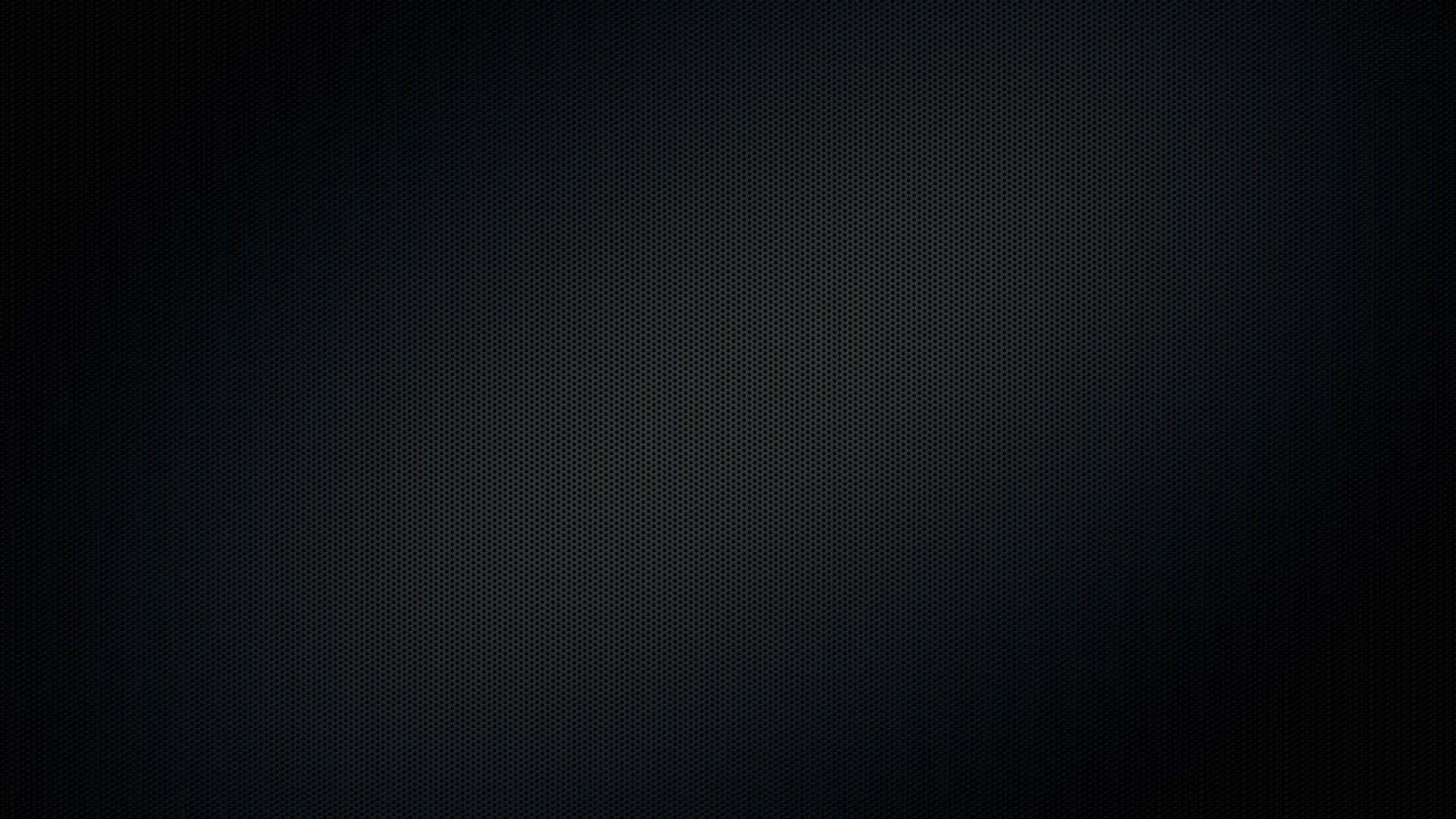 帶有細微漸變和穿孔圖案的深色紋理背景。
