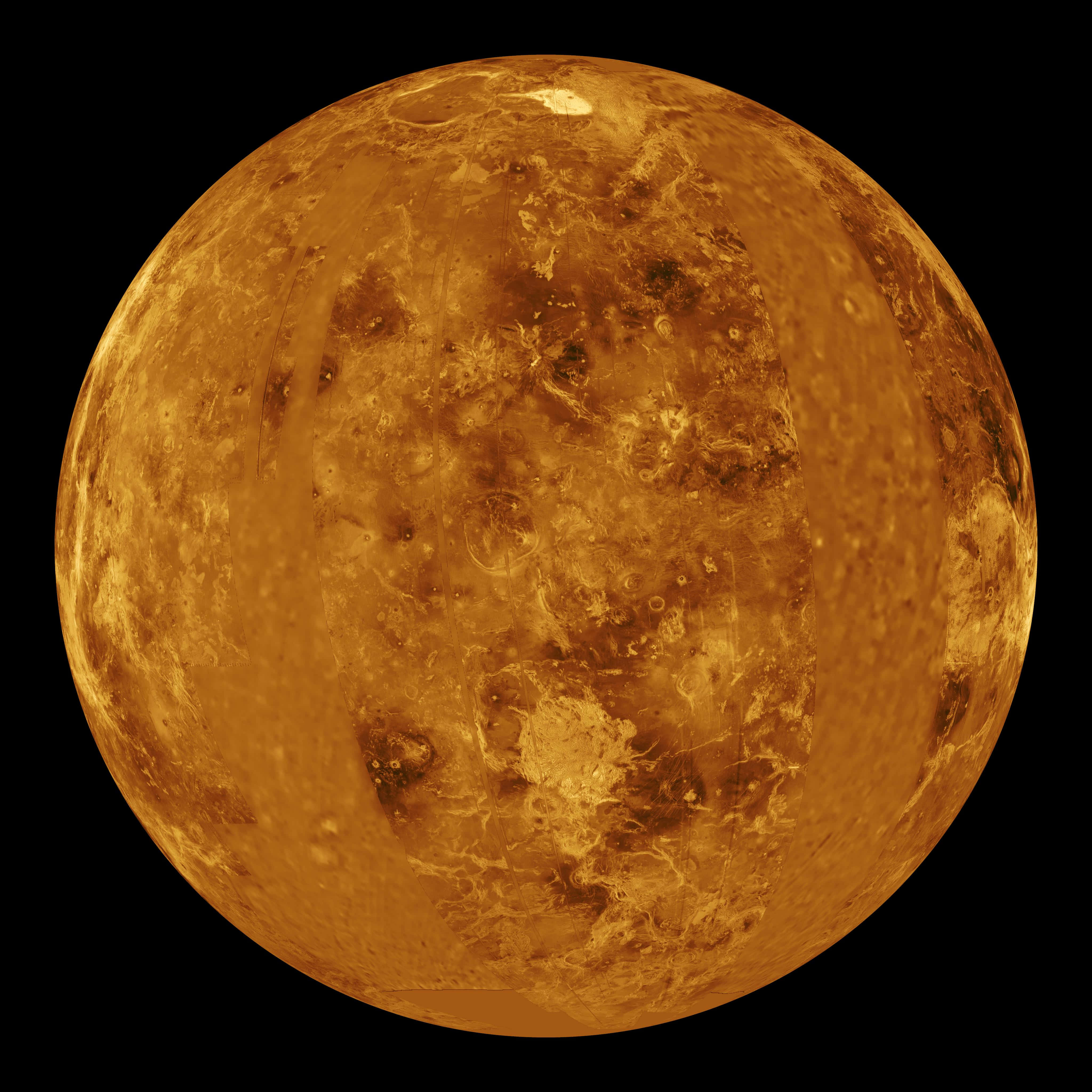 金星在宇宙中熠熠生輝 壁紙 — 金星近距離特寫，在黑色虛空中呈現紋理豐富的金橙色表面，散發光芒。