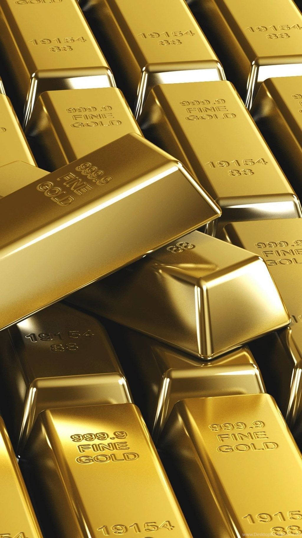 一堆拋光金條，刻有純度和序列號。