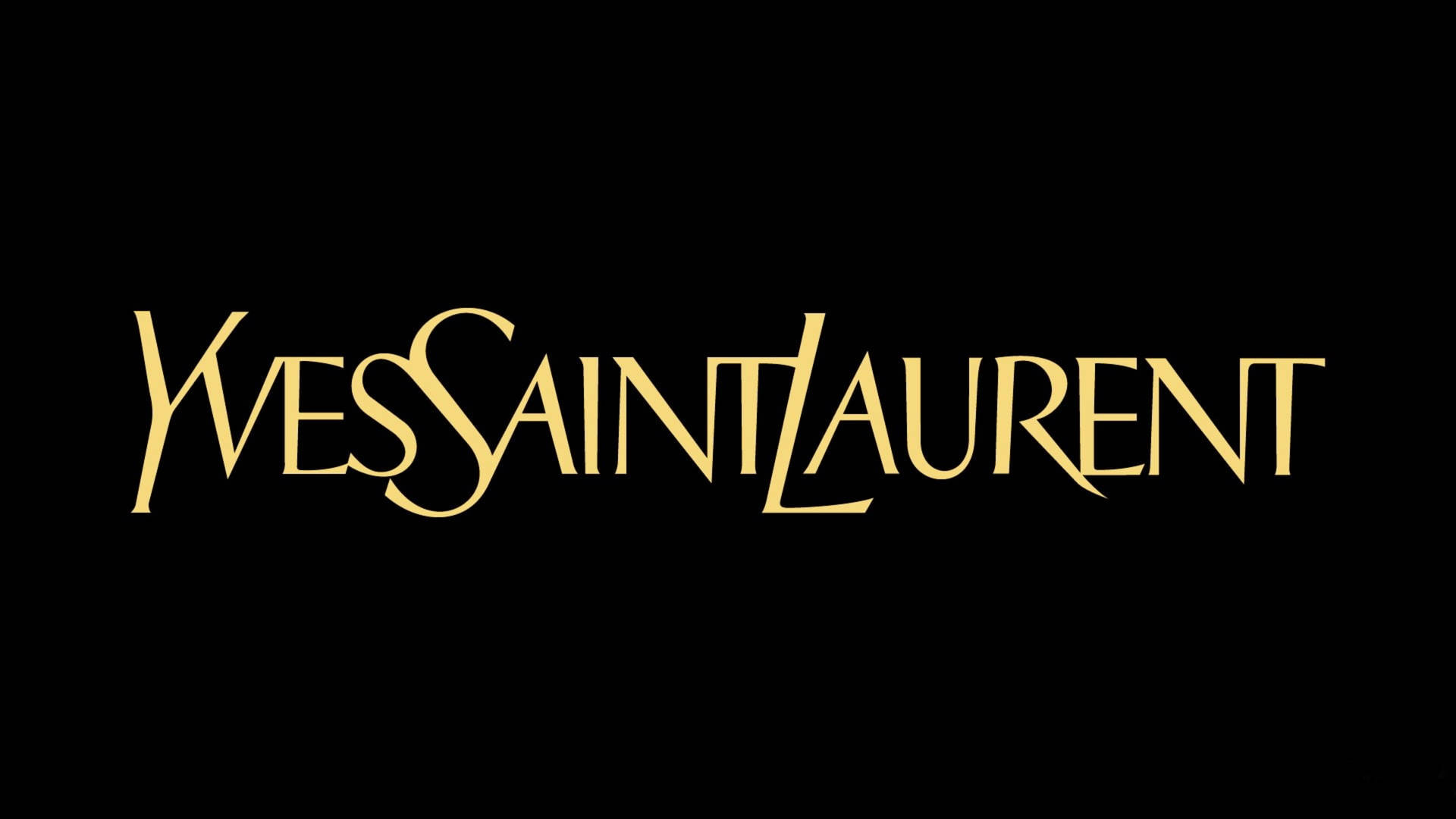 黑色背景上的金色 Yves Saint Laurent 標誌