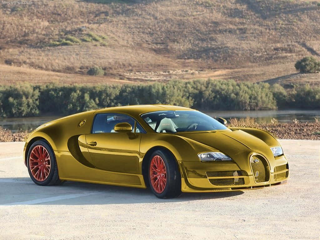 金色Bugatti Veyron配紅色輪胎，日落時停在河流附近。