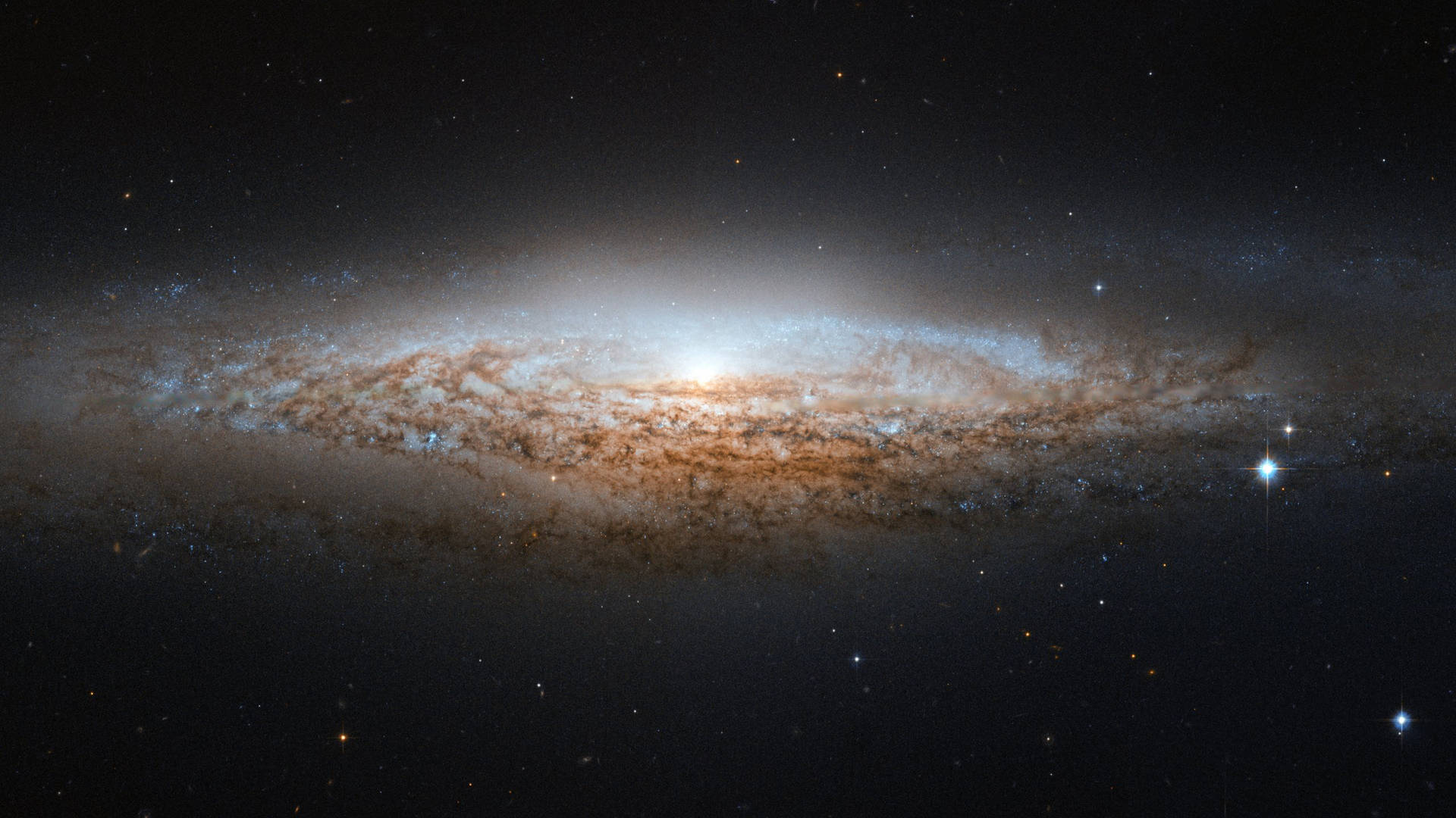 一個帶有發光旋臂和散落恆星的螺旋星系。