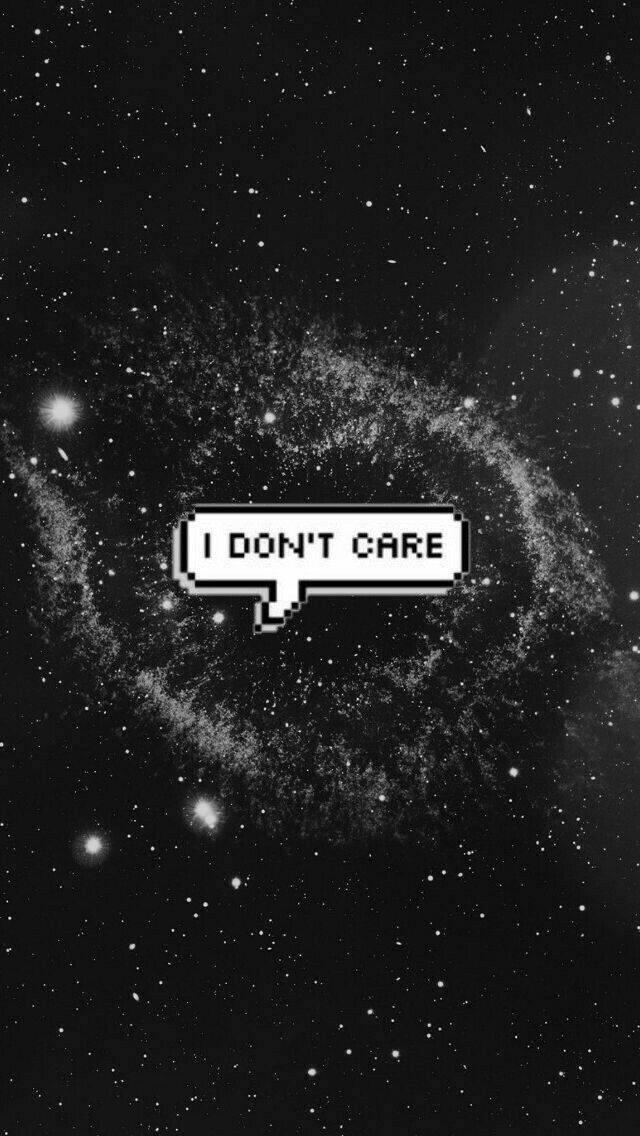銀河系「我不在乎」 壁紙 — 一個像素化的對話氣泡，上面寫著「I DON'T CARE」，漂浮在黑白漩渦星系之上。