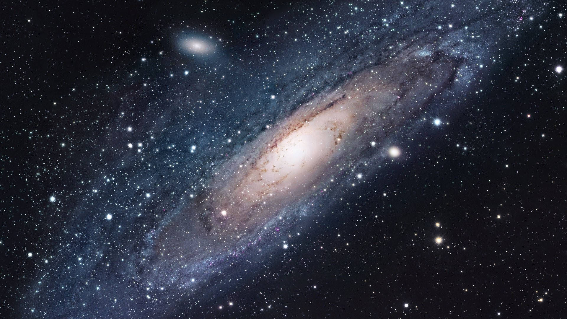 具有明亮核心和星場的螺旋星系 — 銀河 壁紙