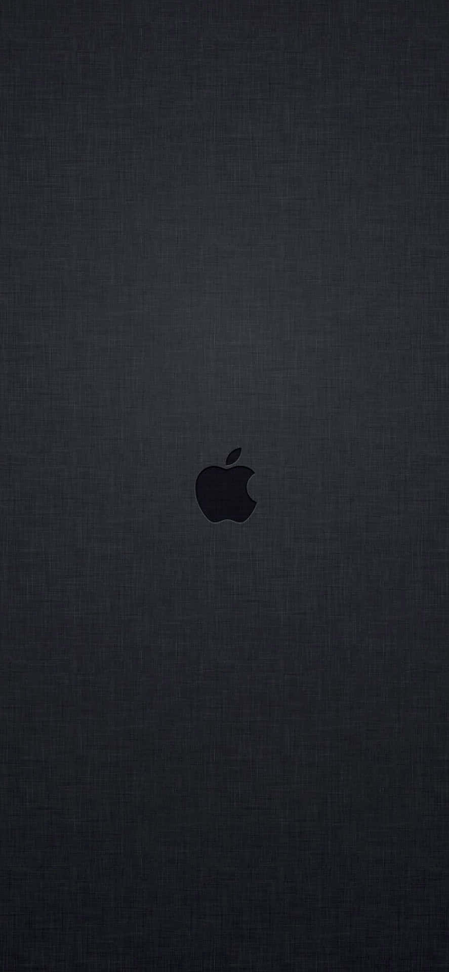 深色紋理布料背景上的黑色Apple標誌。