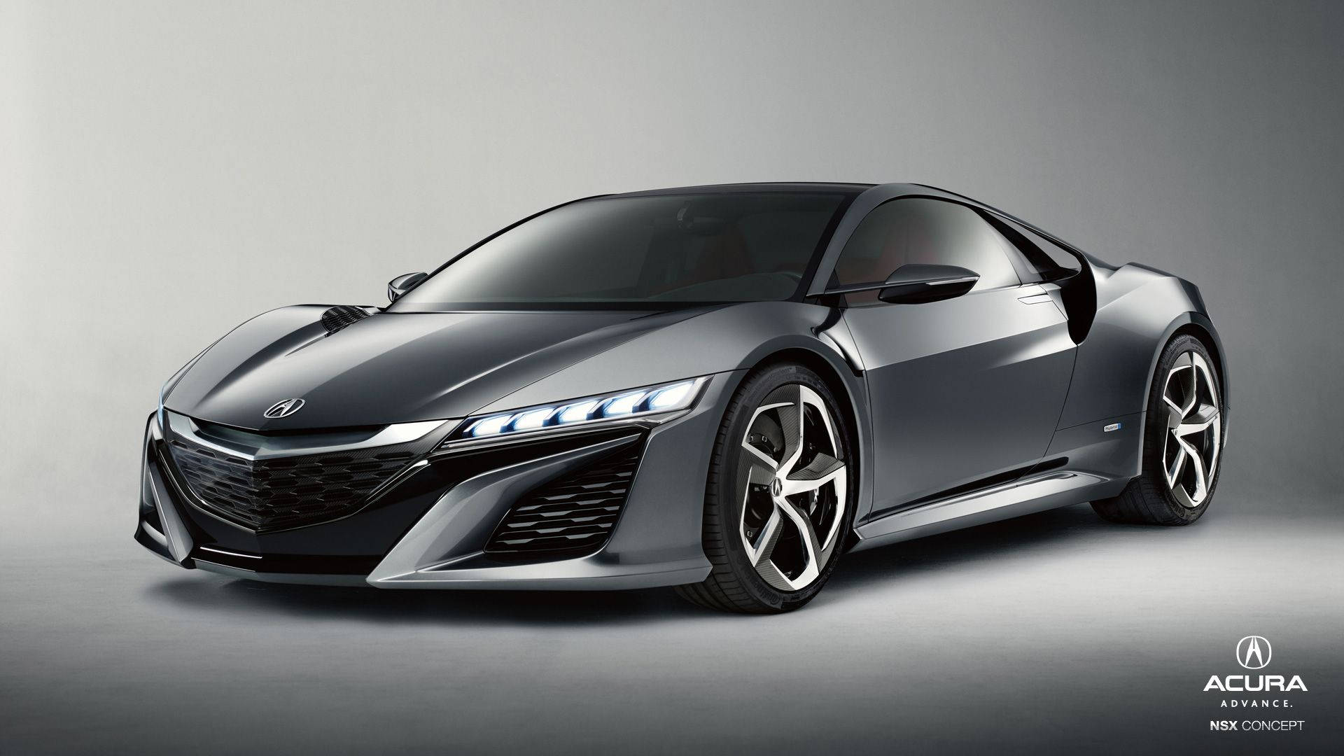 在攝影棚環境中，時尚灰色Acura NSX概念跑車帶有發光頭燈。