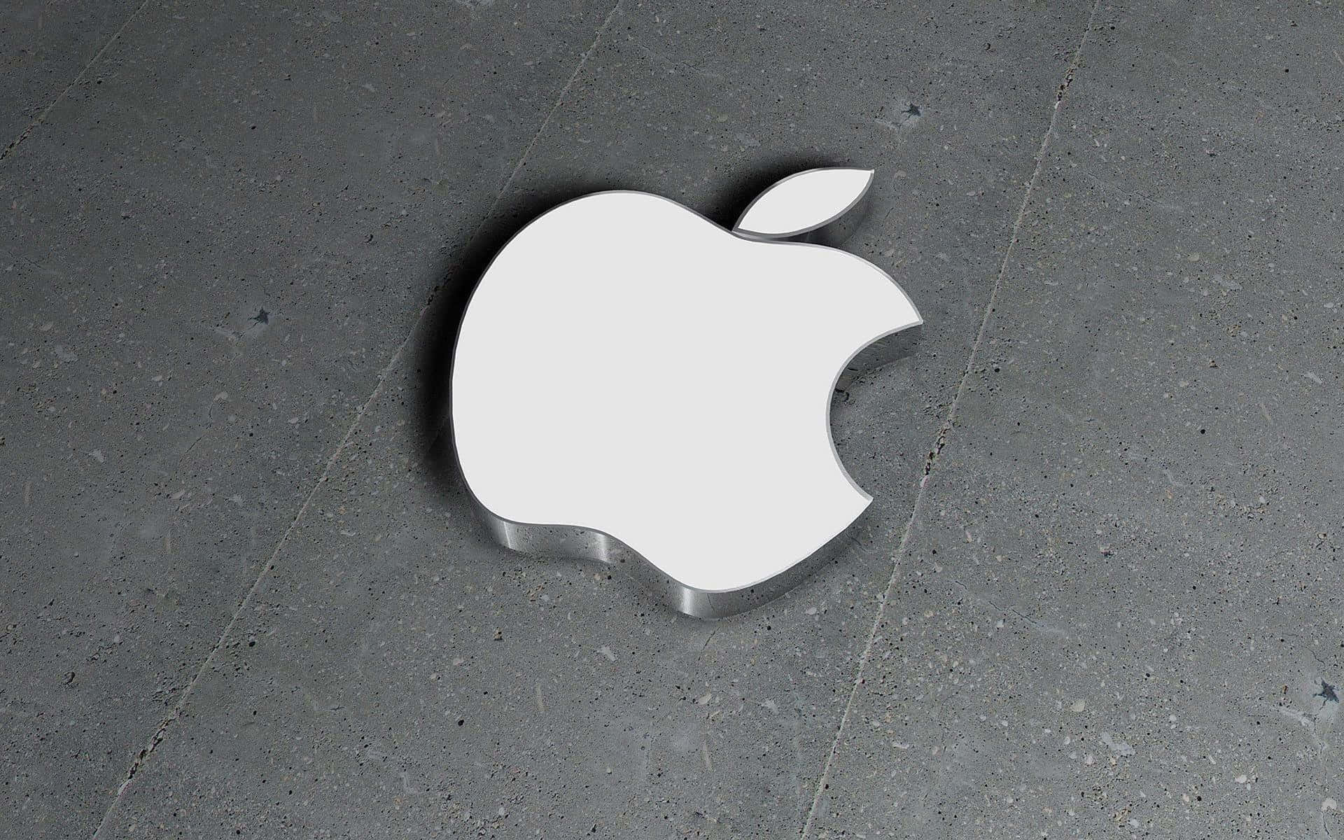 灰色混凝土地板上的白色Apple標誌