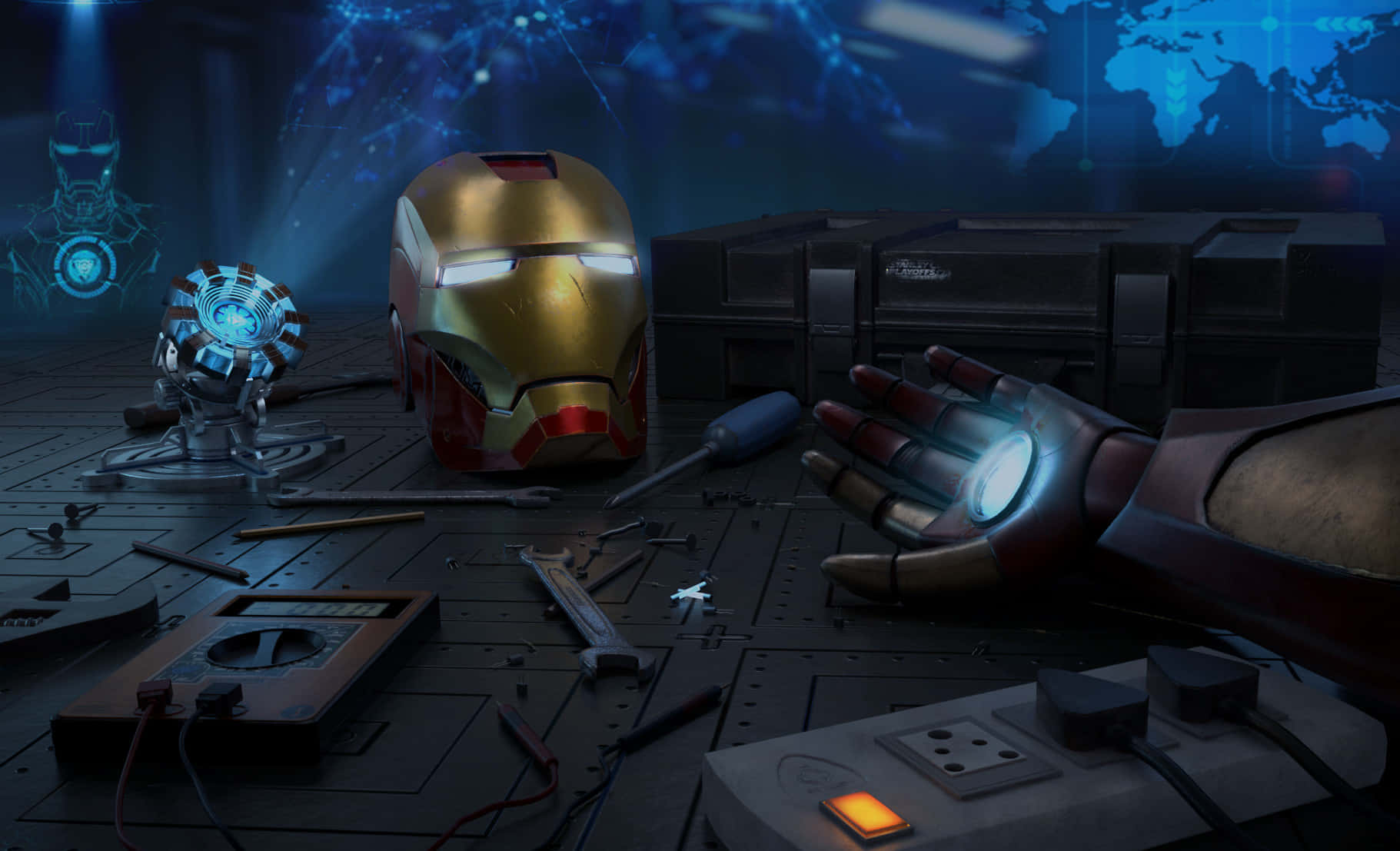 Iron Man Technology 桌布 壁紙 — 鐵甲奇俠的頭盔和發光手套放在一個雜亂的工作室地板上，周圍是工具和科技設備。