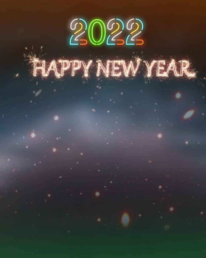 霓虹燈2022和新年快樂文字在繁星點點的夜空中閃爍。