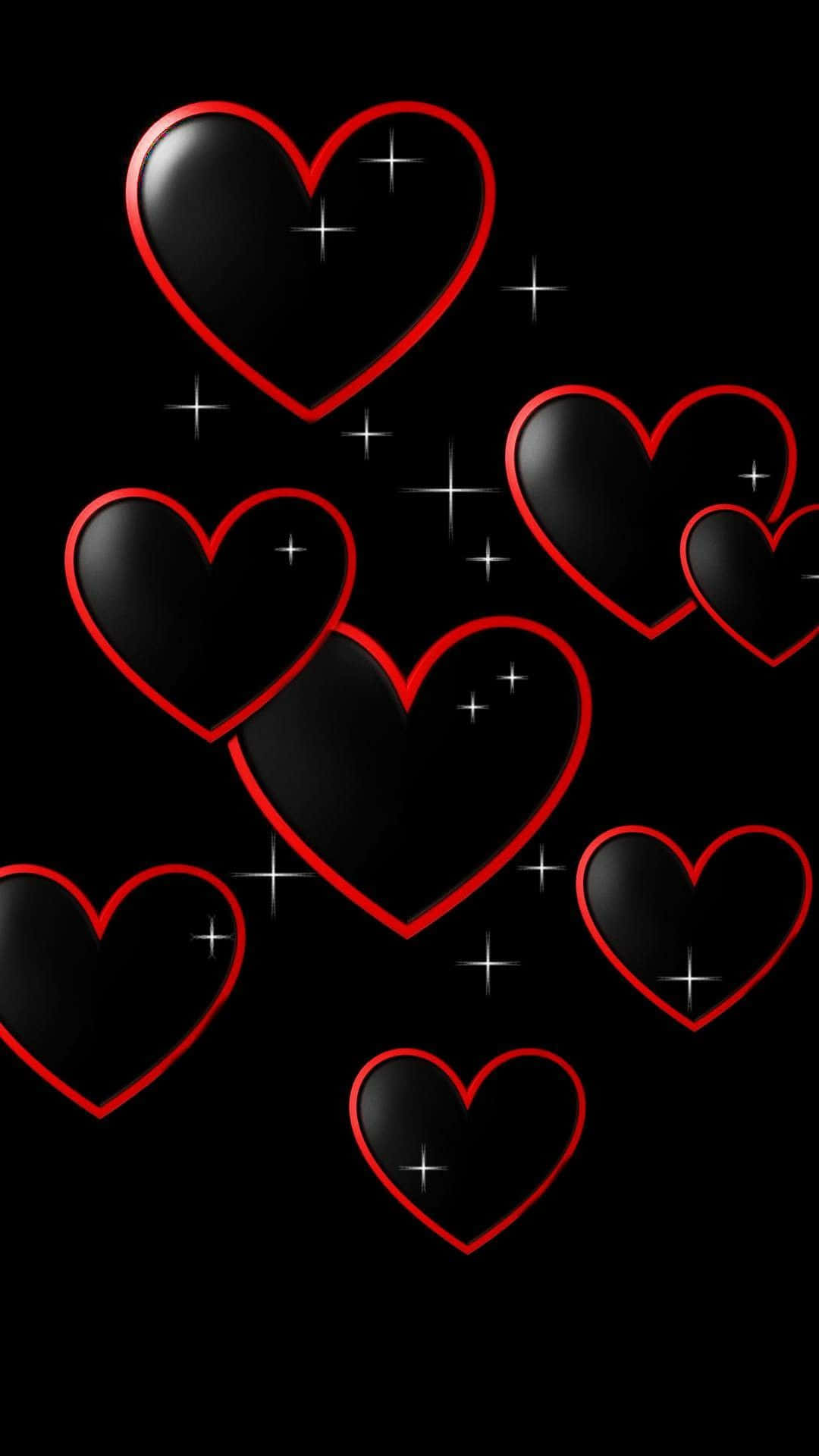 Love Heart 桌布 壁紙 — 閃亮的黑色心形帶有發光的紅色輪廓，漂浮在點綴著閃爍星星的黑暗背景上。