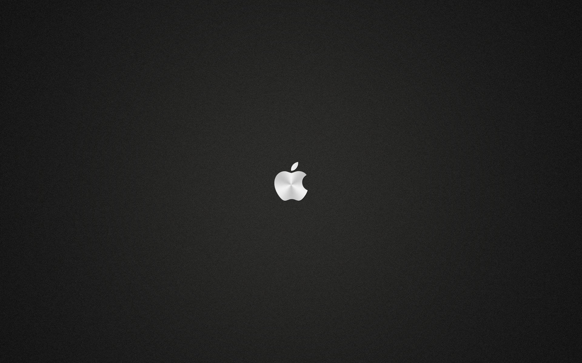 深色紋理背景上的銀色Apple標誌