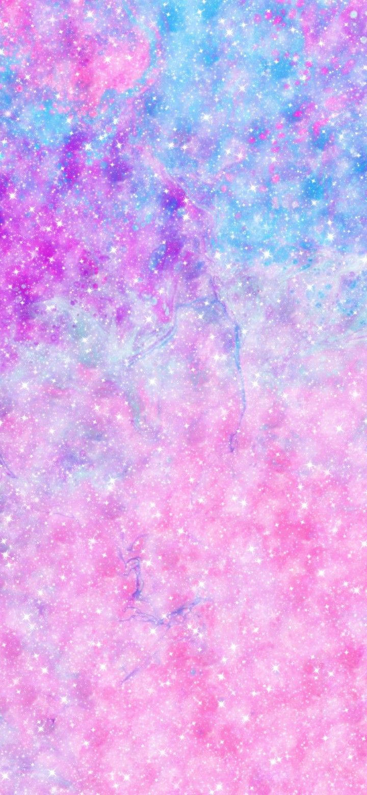 一個充滿閃爍星星和柔和星雲雲團的粉紅色和藍色星系。