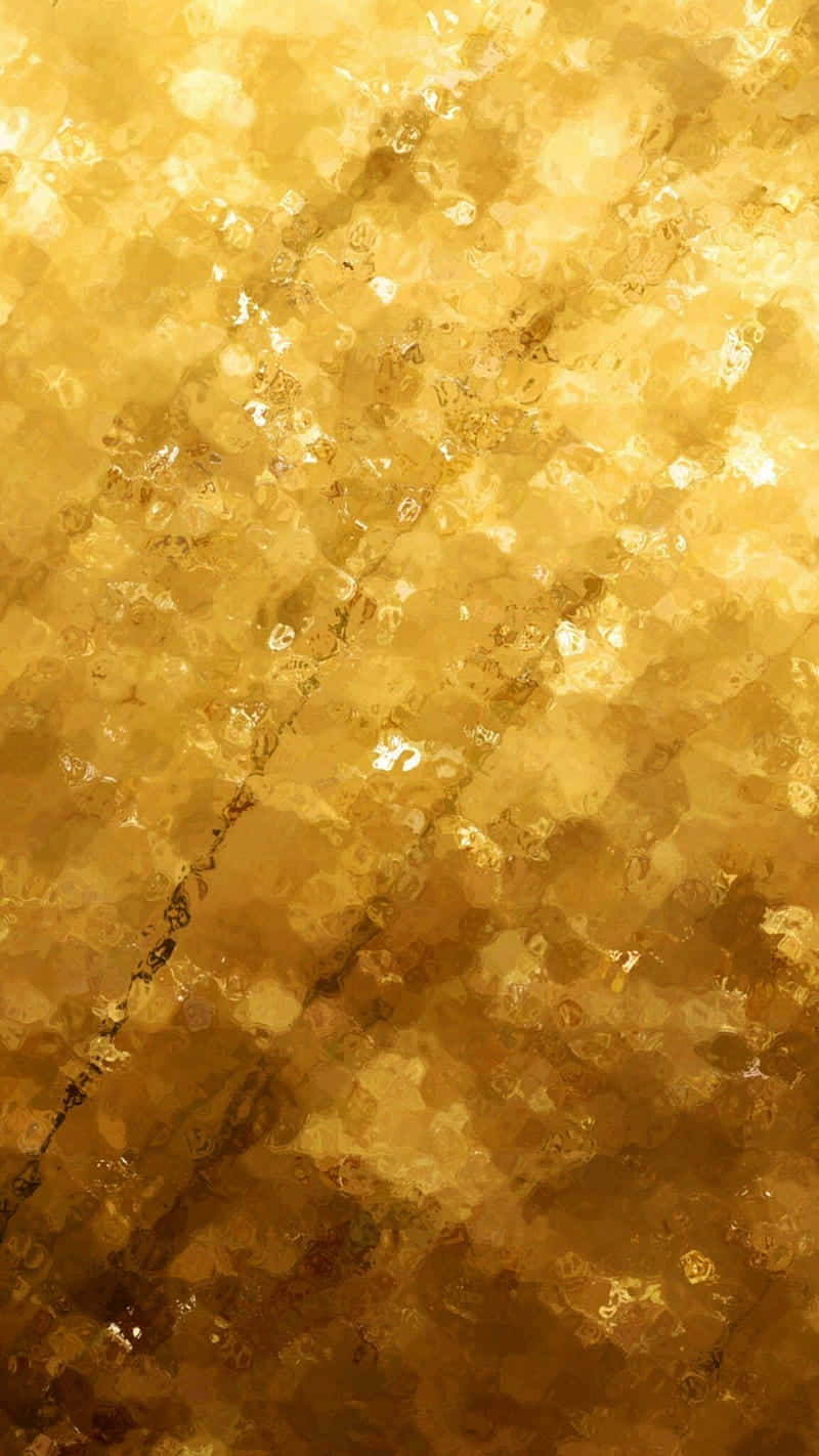 閃耀的金屬金色紋理 壁紙 — 一種閃耀的金色抽象紋理，帶有閃爍的高光和有機漩渦，讓人聯想到熔化的金屬或蜂巢。