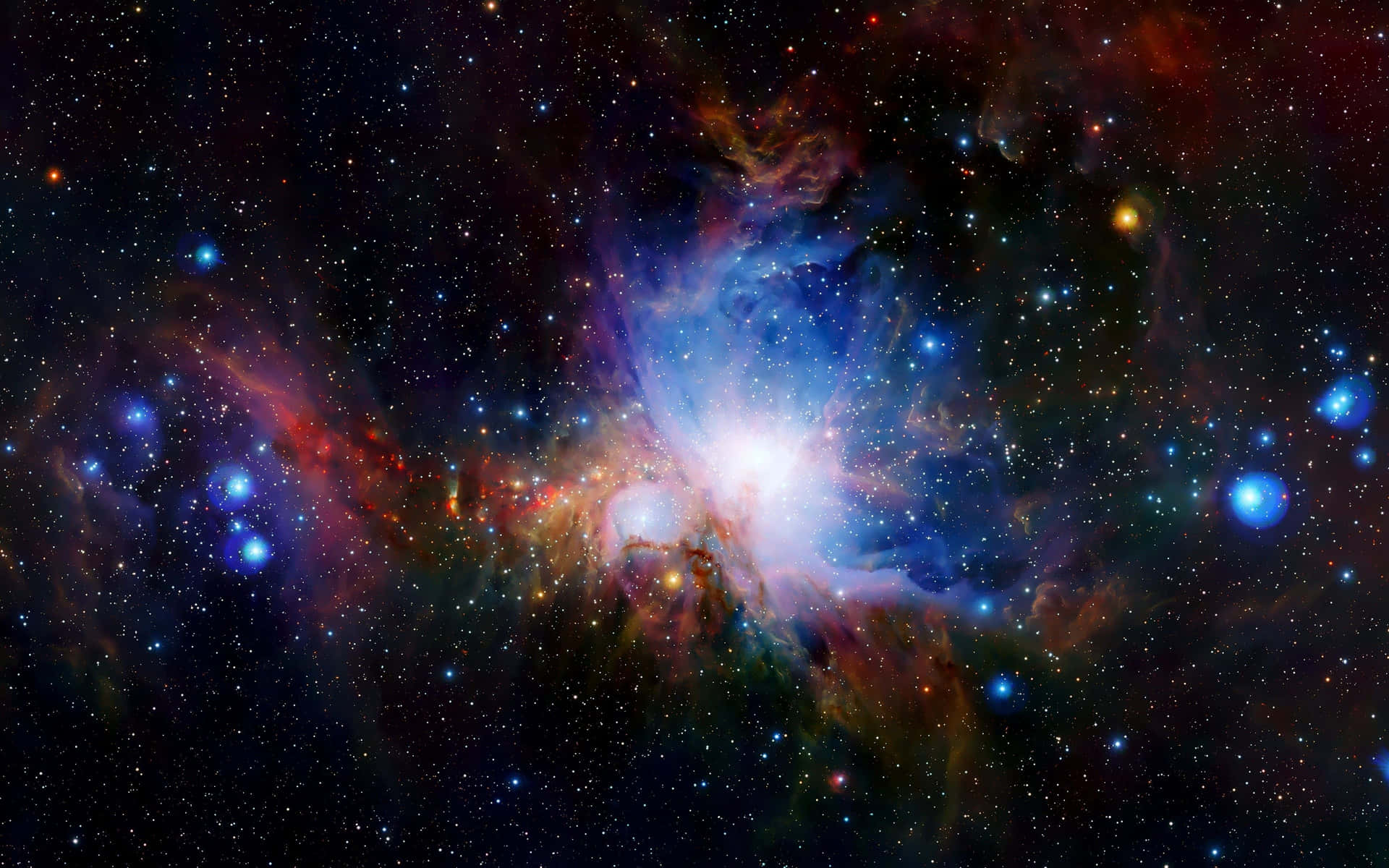 一個色彩繽紛的星雲，在深空的星星環繞下，散發出藍色、紅色和橙色的光芒。