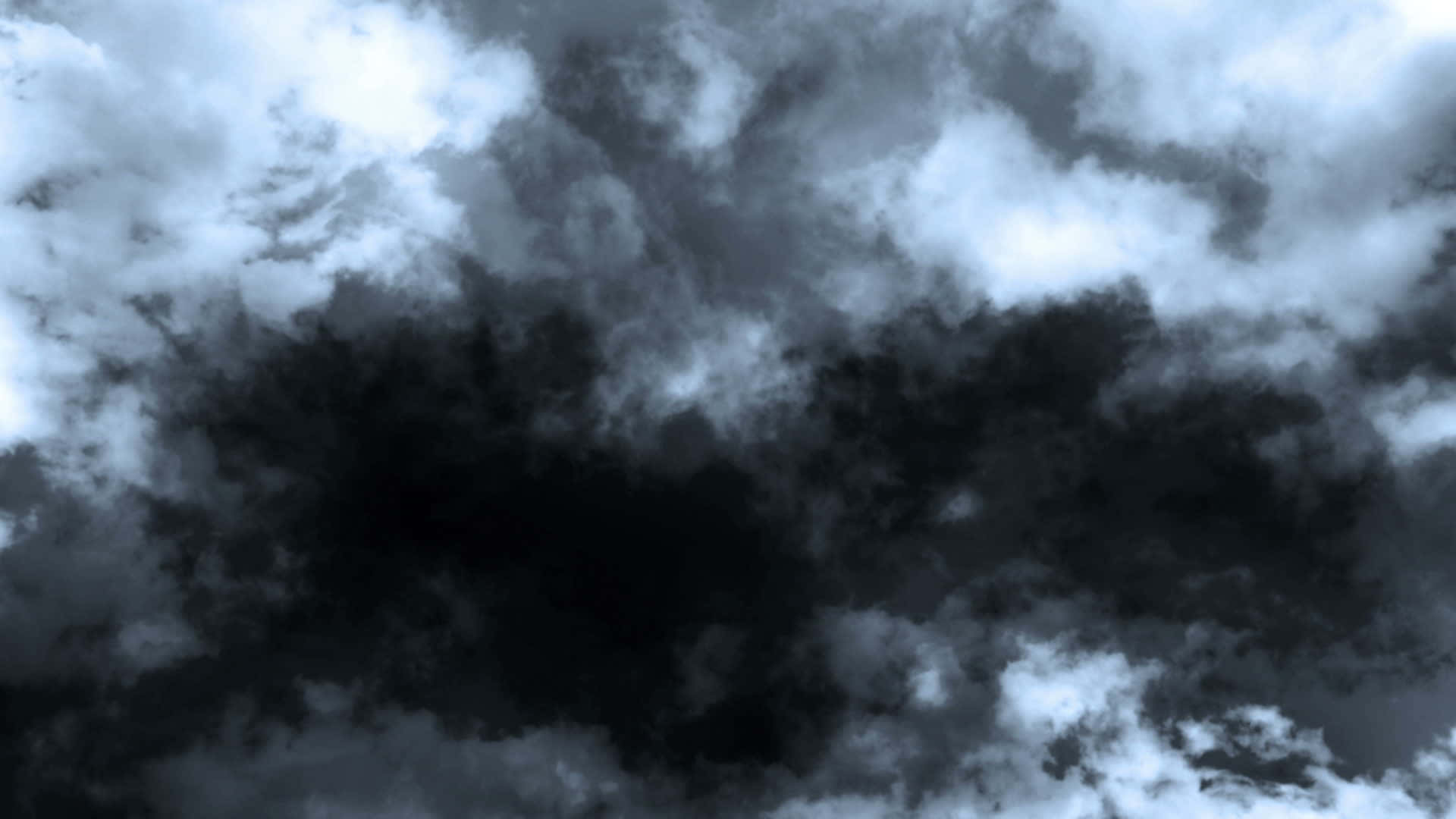 閃電交織的戲劇性暴風雨天空 壁紙 — 戲劇性的風暴雲在單色天空中旋轉，明亮白色與深黑色之間形成鮮明對比。