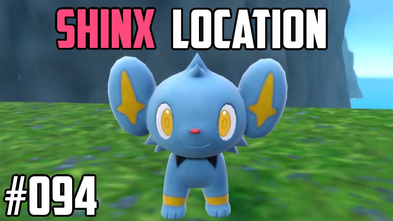 藍色Shinx Pokémon，星形耳仔，企喺草地上嘅電子遊戲場景。