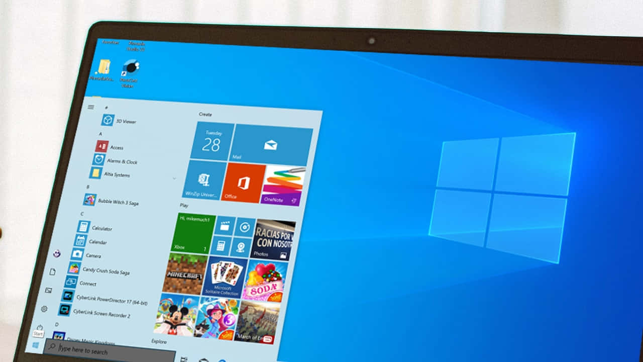 手提電腦顯示Windows 10開始功能表，帶有應用程式圖示和藍色背景。