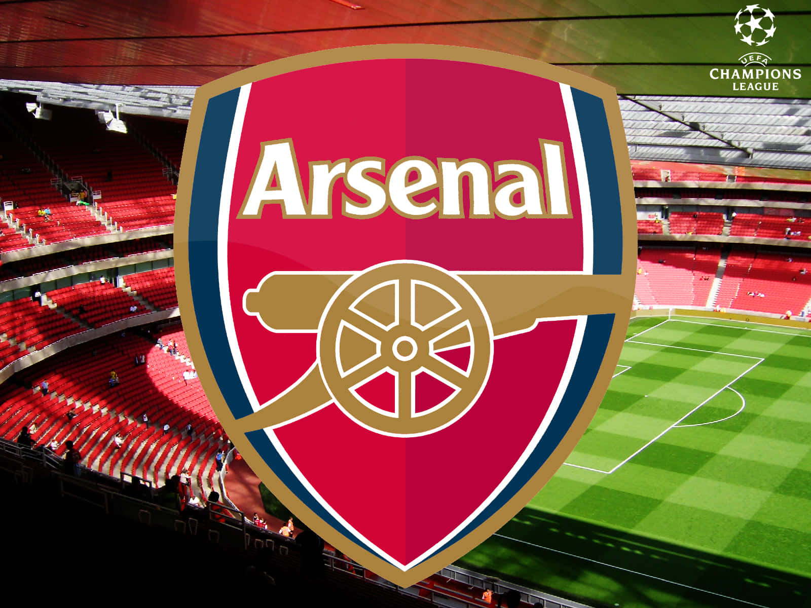 Arsenal 桌布 壁紙 — 阿仙奴足球會徽章在陽光普照的球場中佔據主導地位，紅色座位和綠色草坪。