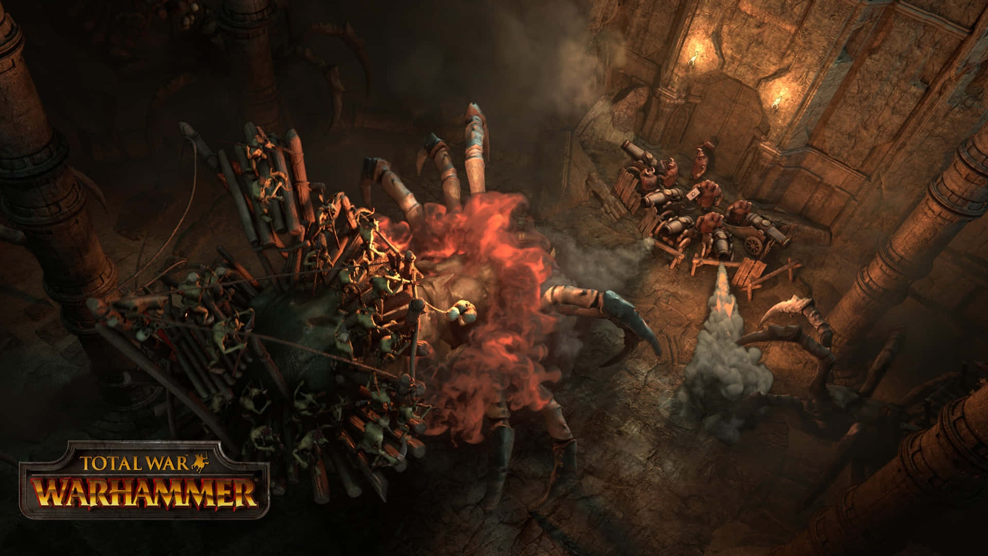阿拉克納洛克蜘蛛巢穴 1920x1080 Total War Warhammer 背景 壁紙 — 一隻怪物般的蜘蛛狀生物在崩塌的石頭廢墟中爆發出一場熾熱的爆炸，而身穿盔甲的戰士們正在混亂的戰鬥中交鋒。