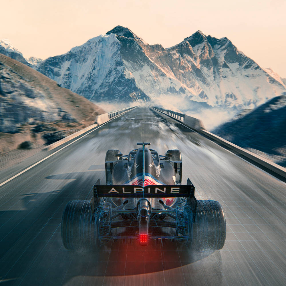 Alpine F1 賽車在日落時分於山路奔馳