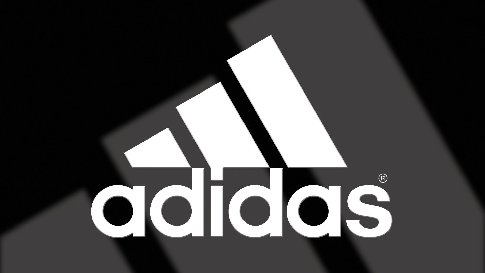 白色adidas標誌在黑灰抽象背景上