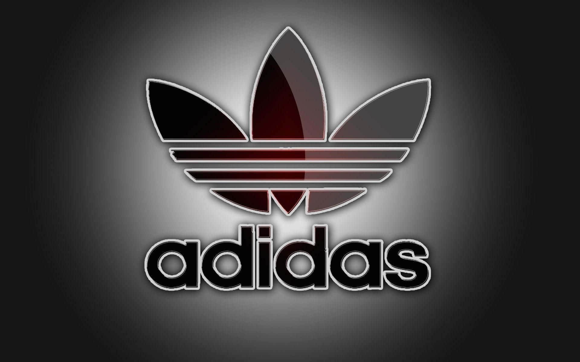 深色漸變背景上帶有發光紅色和黑色三葉草的Adidas標誌