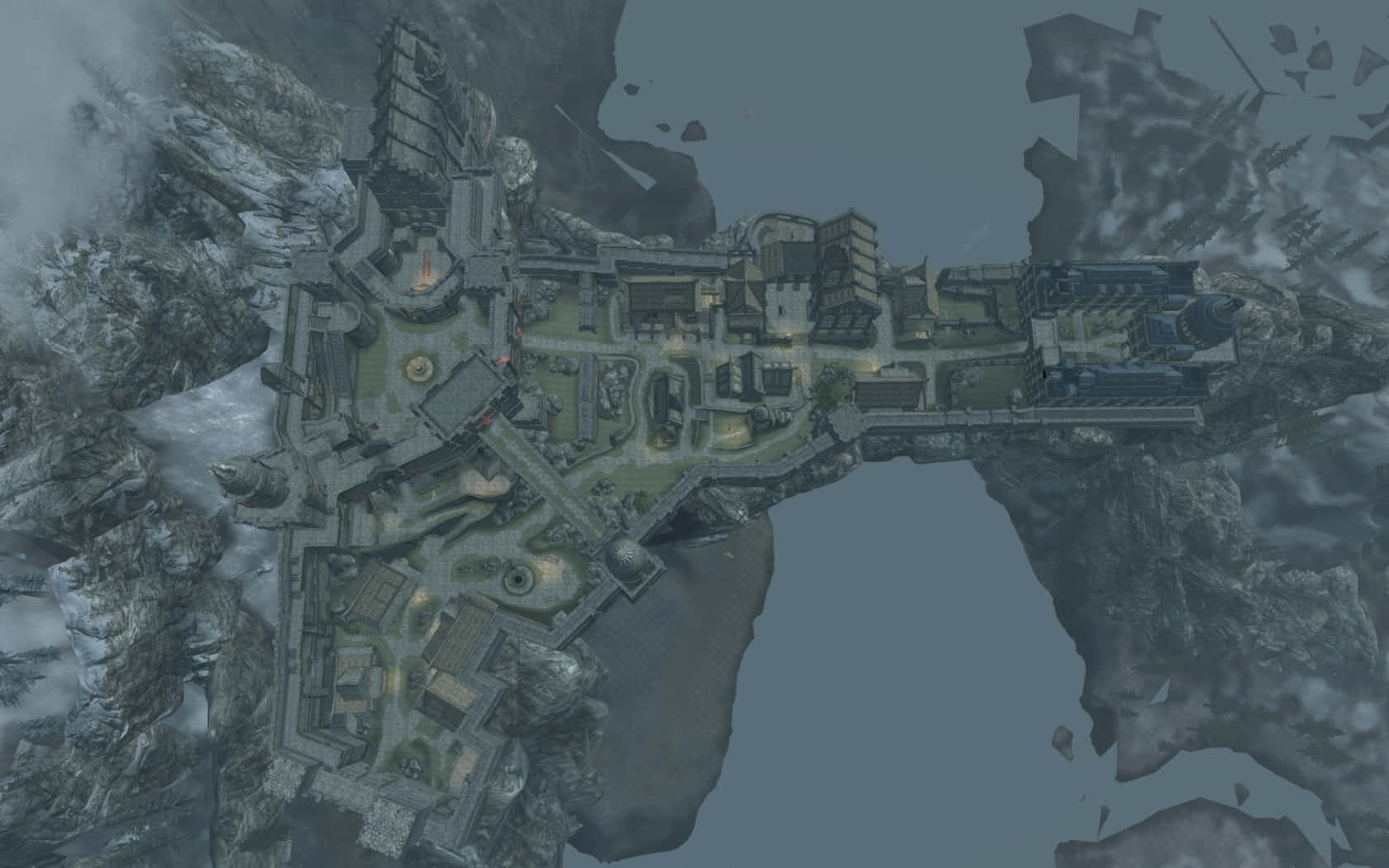 Skyrim Solitude 桌布 壁紙 — 陰暗天空下，一座廣闊的浮空要塞城市坐落於崎嶇山峰之間。