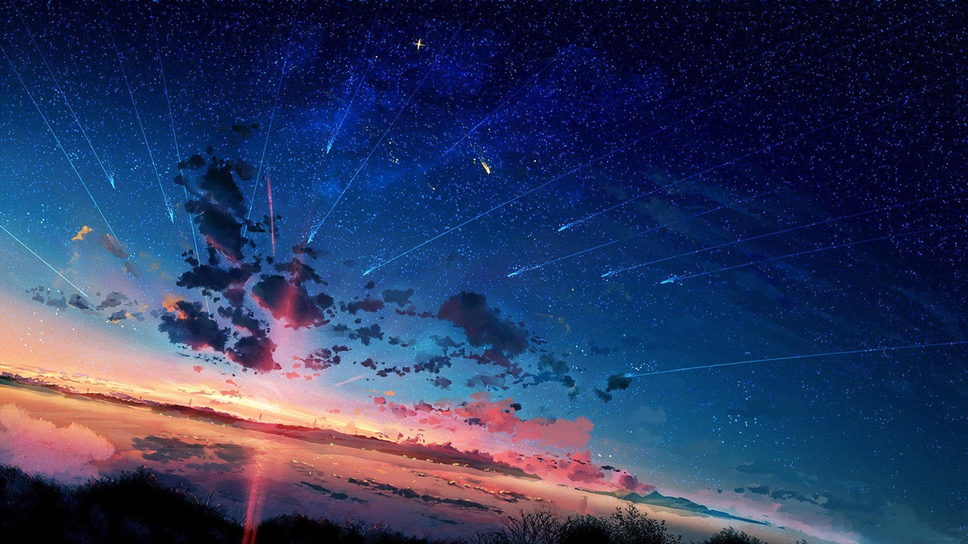 流星和星星照亮了剪影景觀之上的暮色天空。