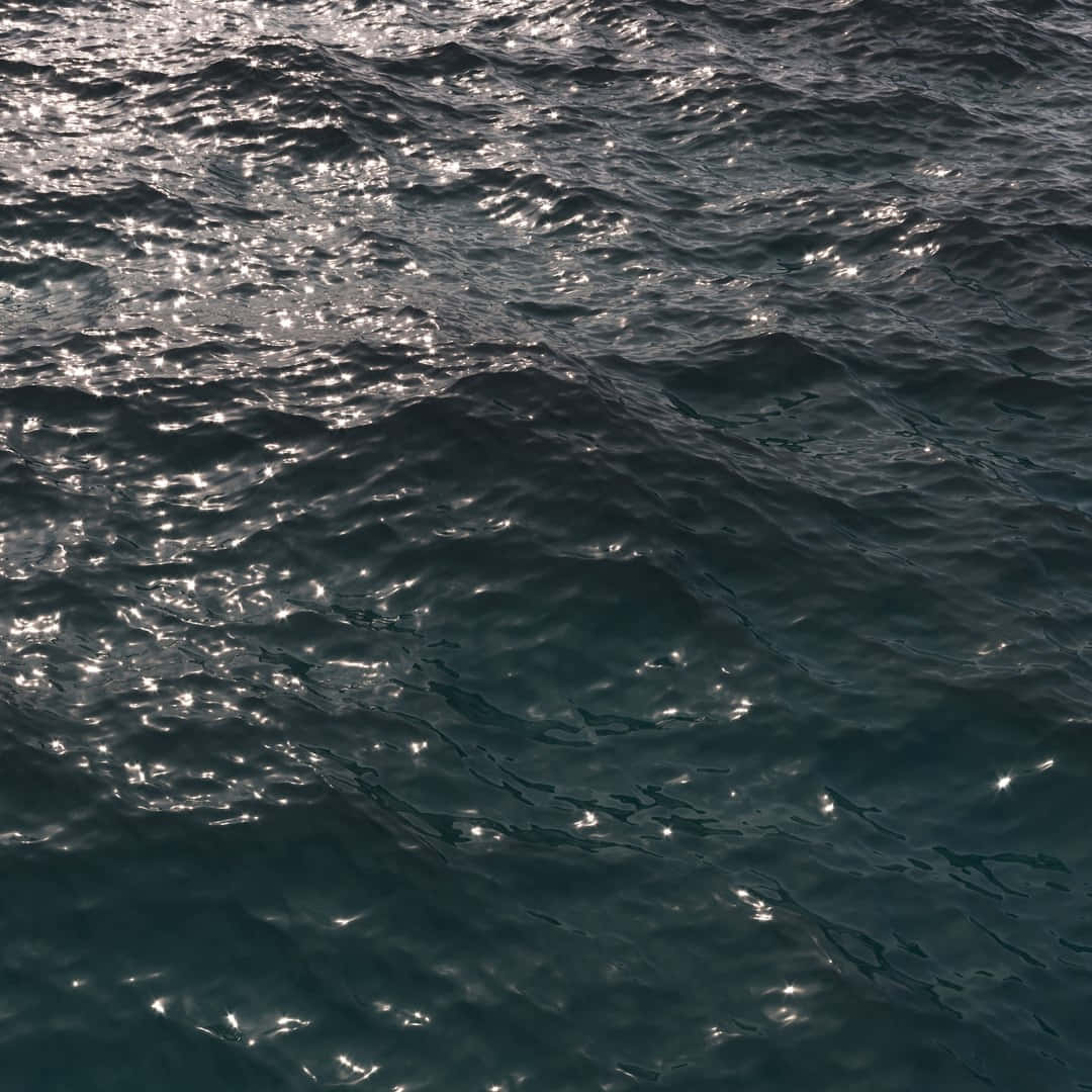 3d Ocean 桌布 壁紙 — 陽光在寧靜的自然海景中，在深藍綠色的海浪上閃爍。