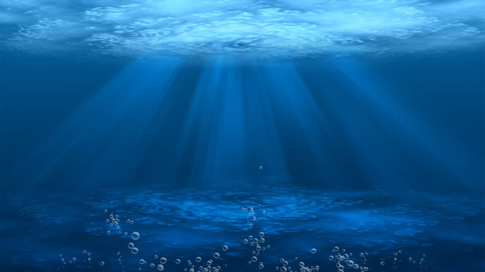 水 桌布 壁紙 — 陽光穿透海面，在漣漪的水面和浮動的氣泡上投射出空靈的藍色光線。