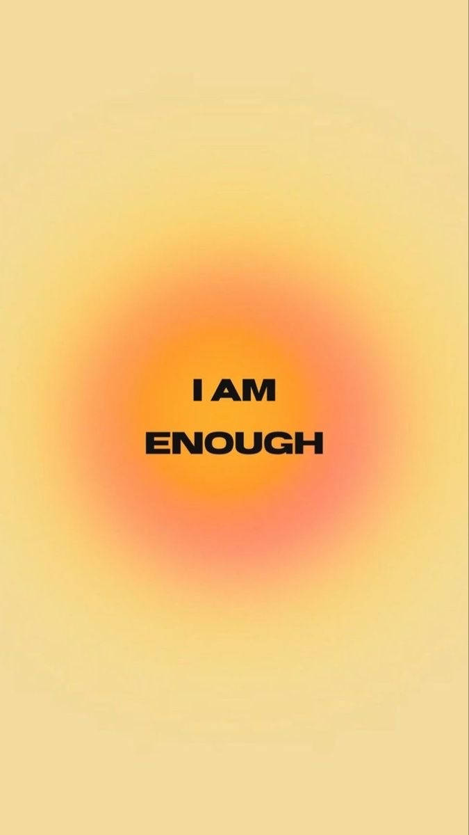 在溫暖的漸變背景上的勵志文字「I AM ENOUGH」。