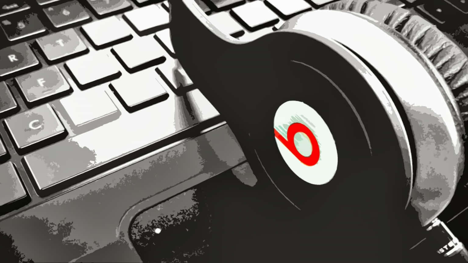 隨時隨地在筆記本電腦上聽音樂 壁紙 — 一對黑色 Beats 耳機放在一個帶有風格化紅色標誌的鍵盤上，背景為單色。