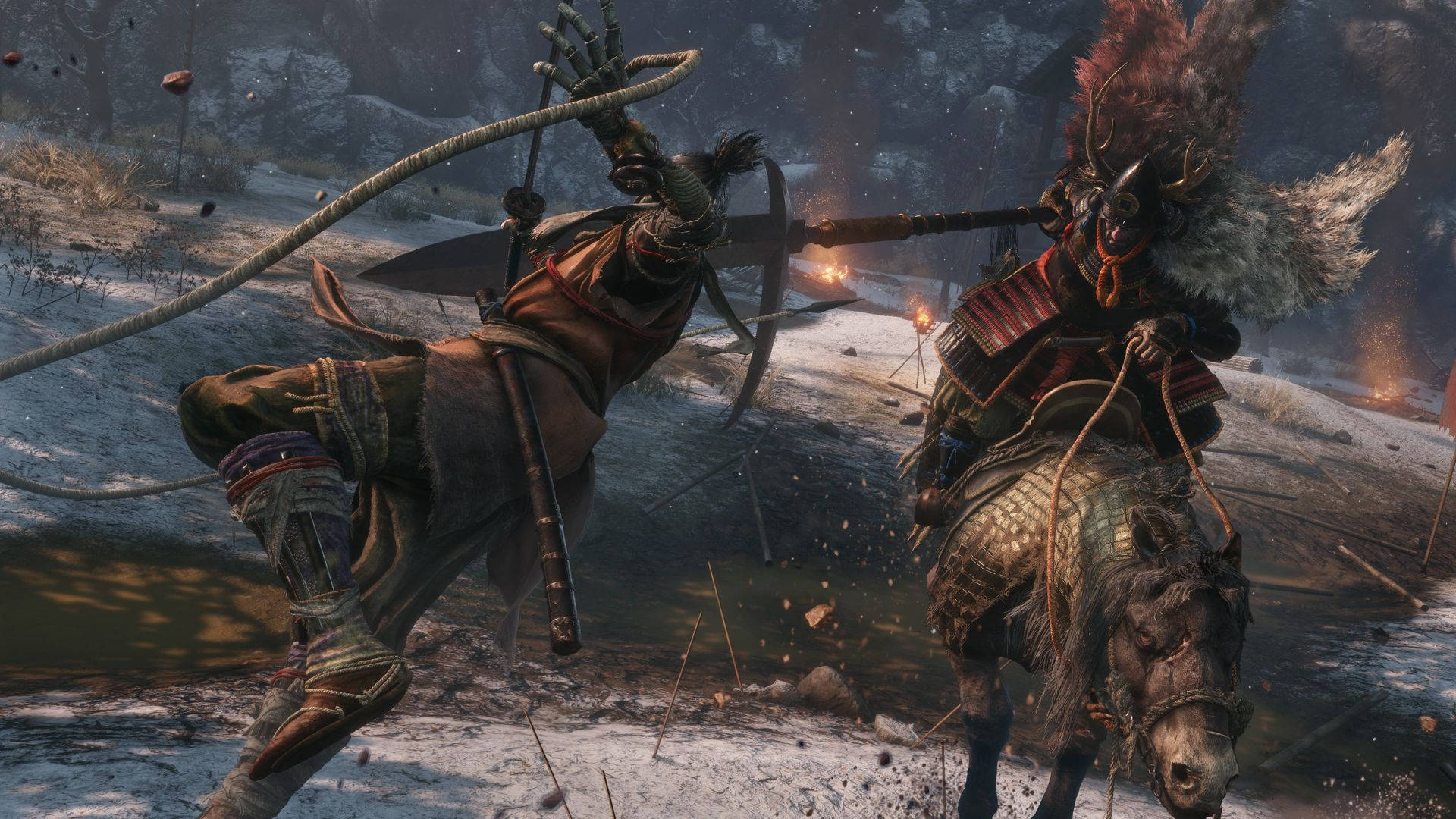 兩名武士戰士在雪地中用火和武器戰鬥。