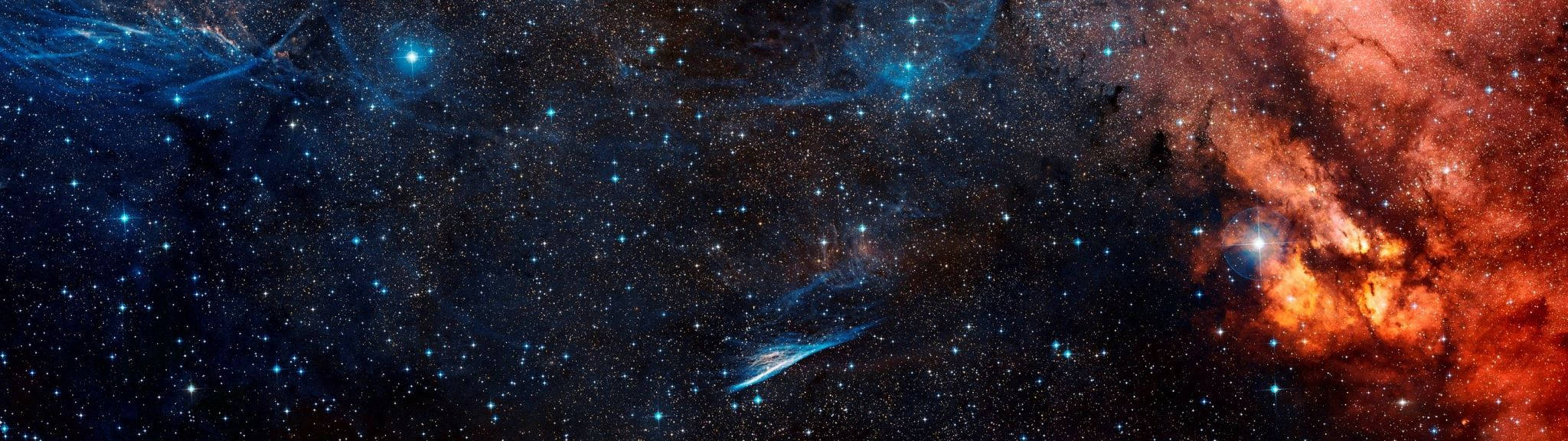 廣闊的宇宙場景，深空中閃耀的星雲和無數星辰。