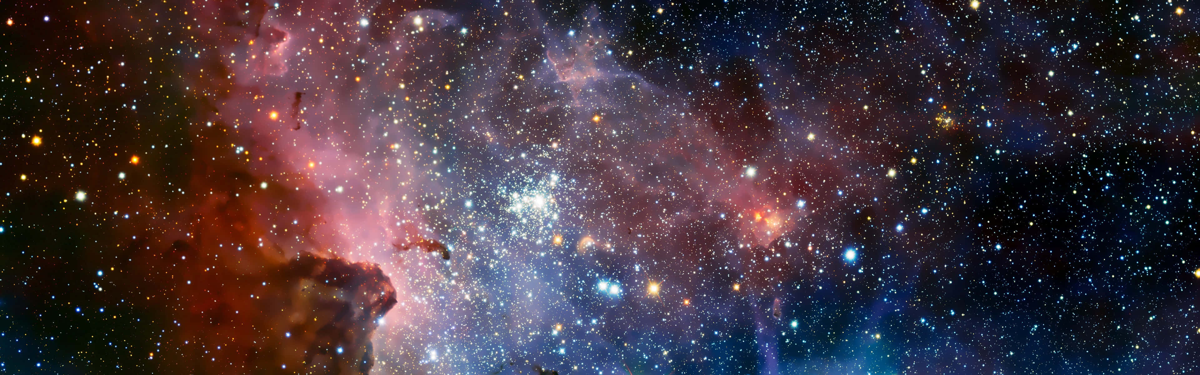廣闊的宇宙場景，色彩繽紛的星雲和明亮的恆星在黑暗的太空中。